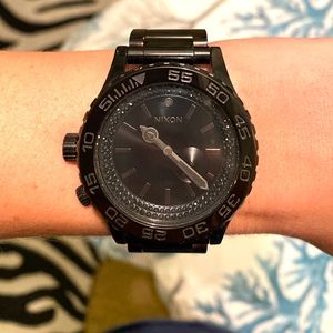 Nixon Women’s all black watch with crystals
